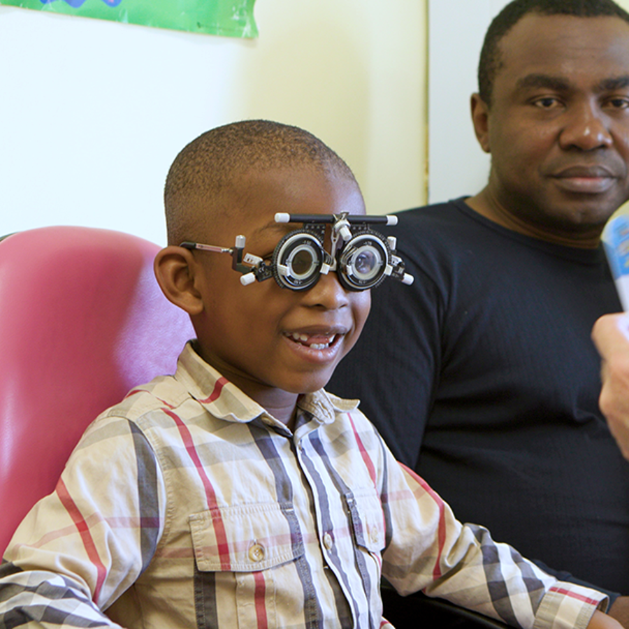 Boy Smiling During Eye Examination