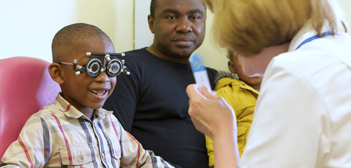 Boy Smiling During Eye Examination