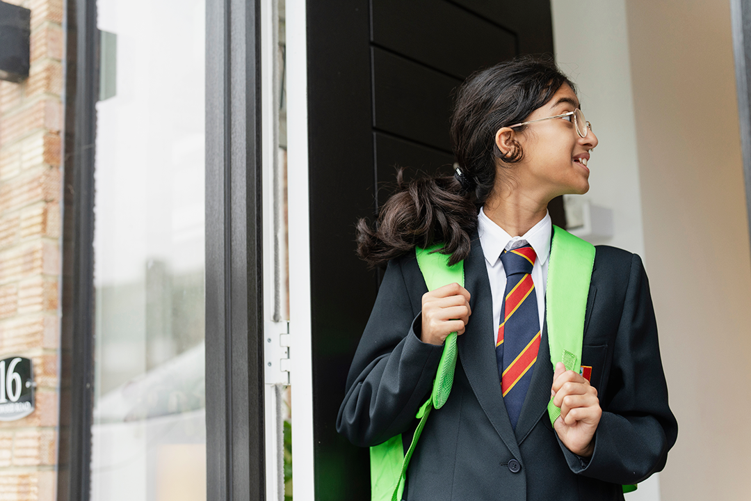 Young Teenager Standing In Doorway Ready For School