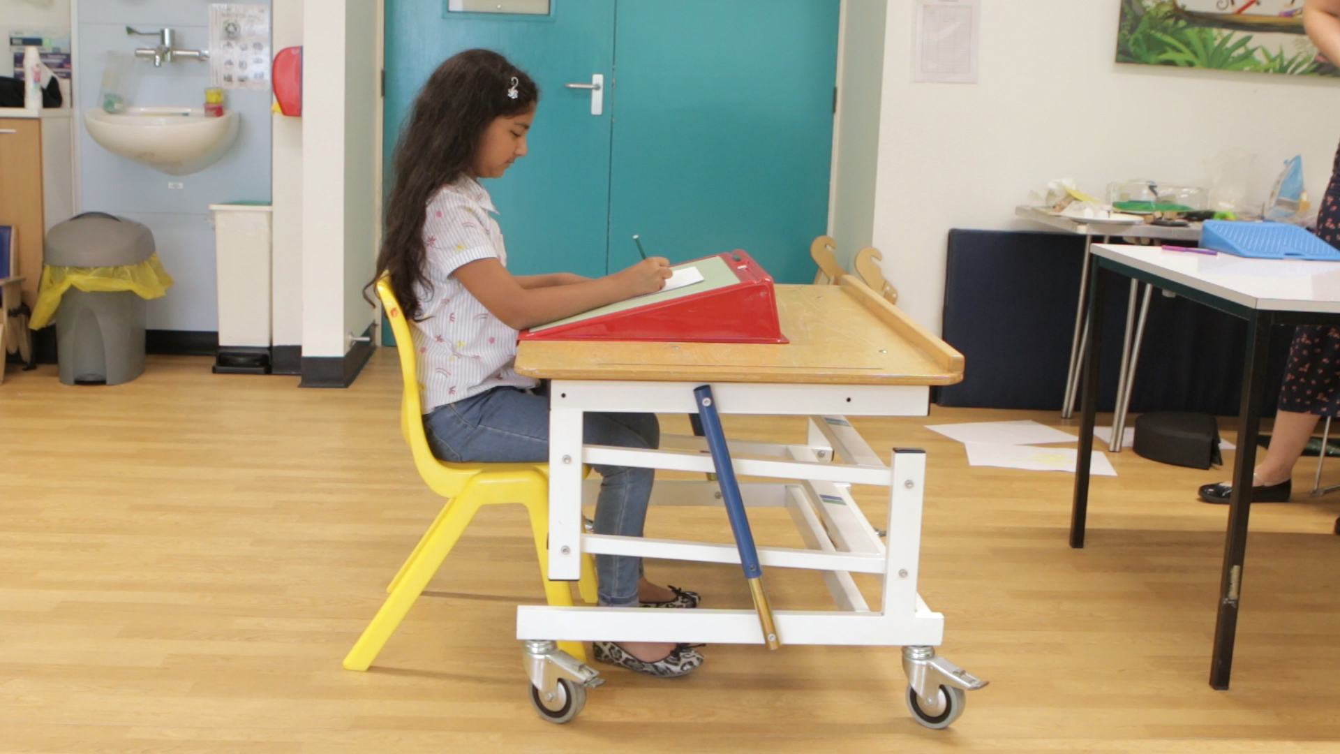 Child sat a table with good posture