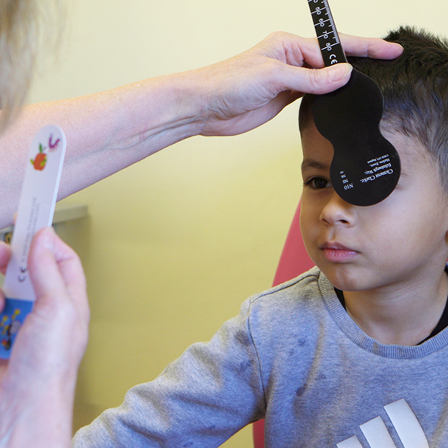 Boy During Eye Exam At Clinic