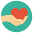 Hand holding heart on green background